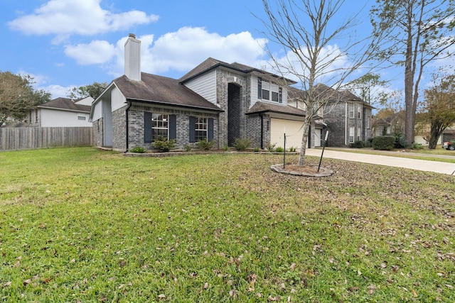 view of front property with a garage and a front yard