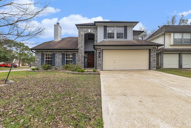 view of front of property with a front lawn and a garage