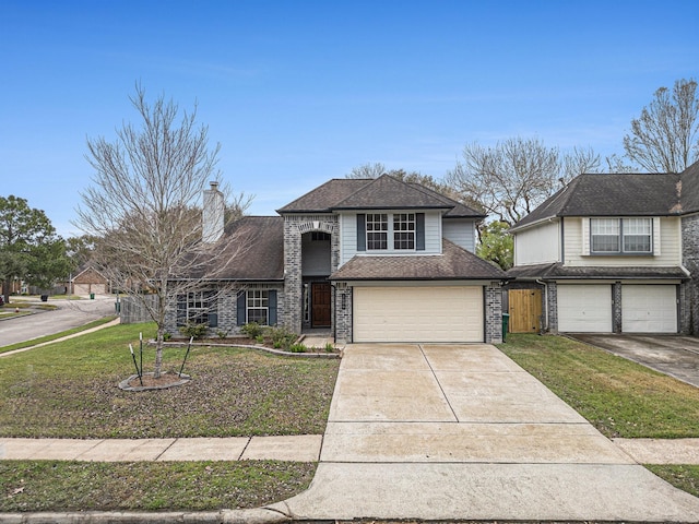 front of property featuring a front yard and a garage