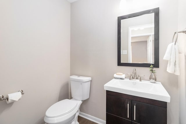 bathroom with toilet and vanity