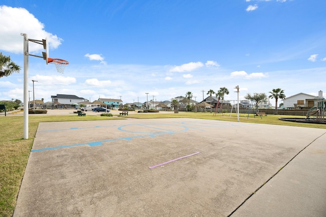 view of sport court featuring playground community, a lawn, and community basketball court