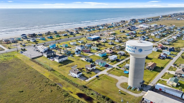 aerial view with a water view and a view of the beach