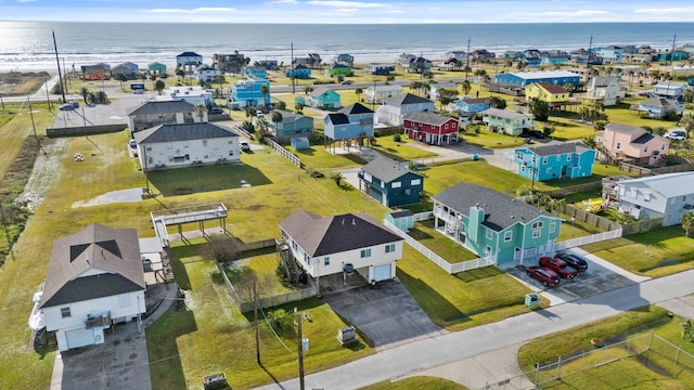 bird's eye view featuring a residential view and a water view