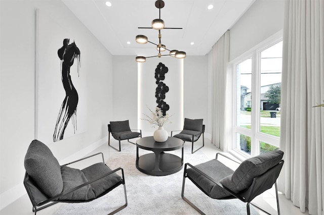 sitting room with a chandelier