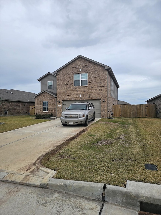 view of front of property featuring a garage and a front yard