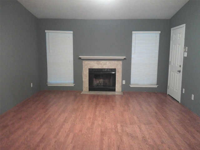 unfurnished living room featuring wood-type flooring