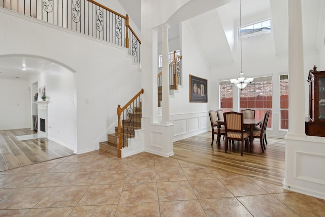 interior space featuring a chandelier and a towering ceiling