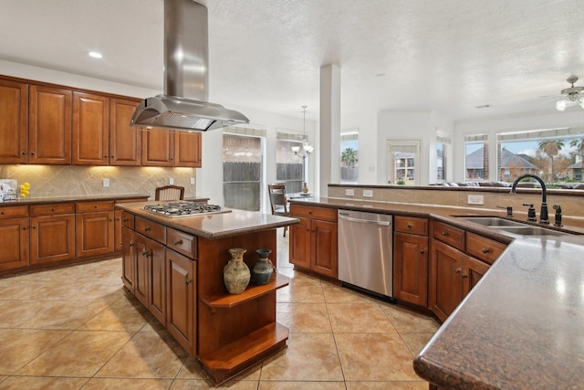 kitchen featuring a center island, island exhaust hood, stainless steel appliances, sink, and light tile patterned floors