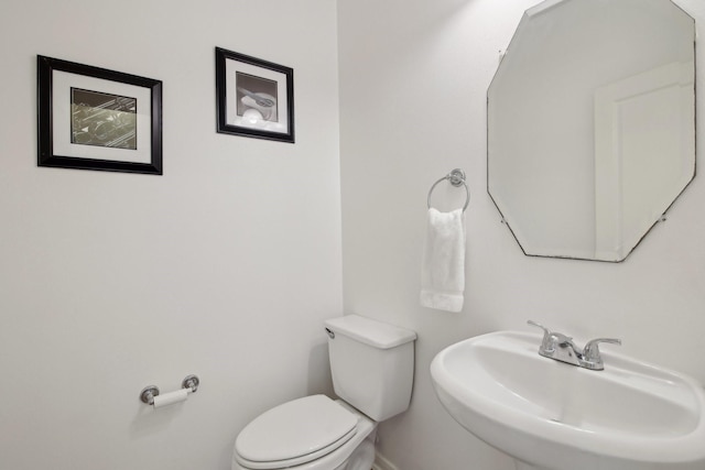 bathroom with toilet and sink