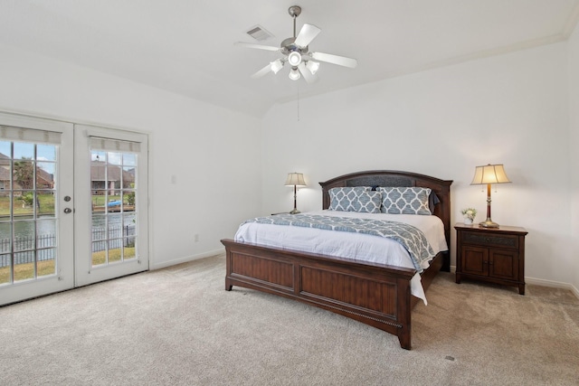 bedroom with ceiling fan, access to exterior, light carpet, and french doors