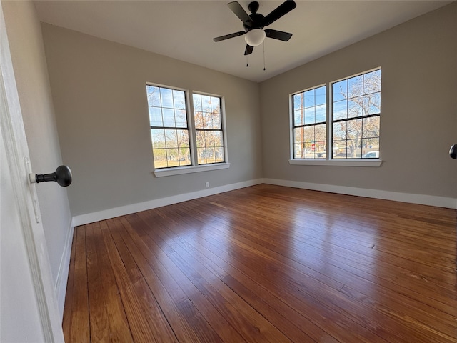 unfurnished room with hardwood / wood-style flooring and ceiling fan