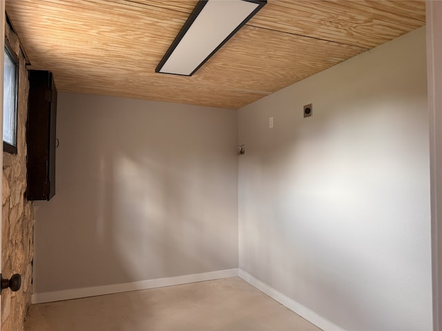 unfurnished room with wood ceiling