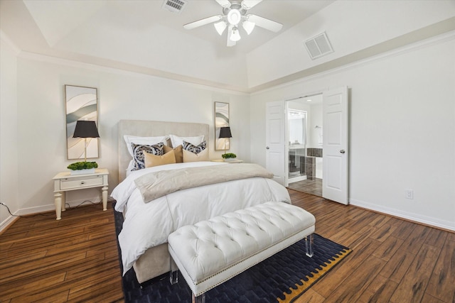 bedroom featuring ceiling fan, dark wood-type flooring, a raised ceiling, and vaulted ceiling