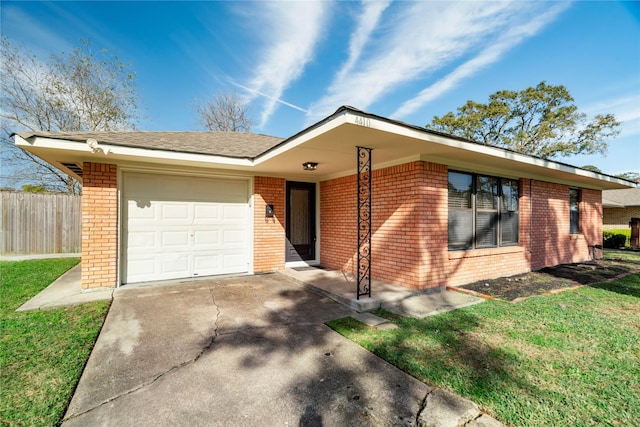 single story home featuring a front yard and a garage