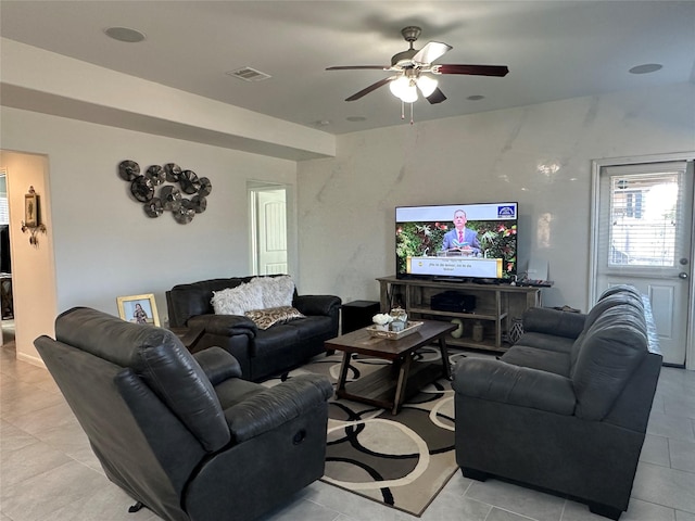 living room with ceiling fan and light tile patterned floors