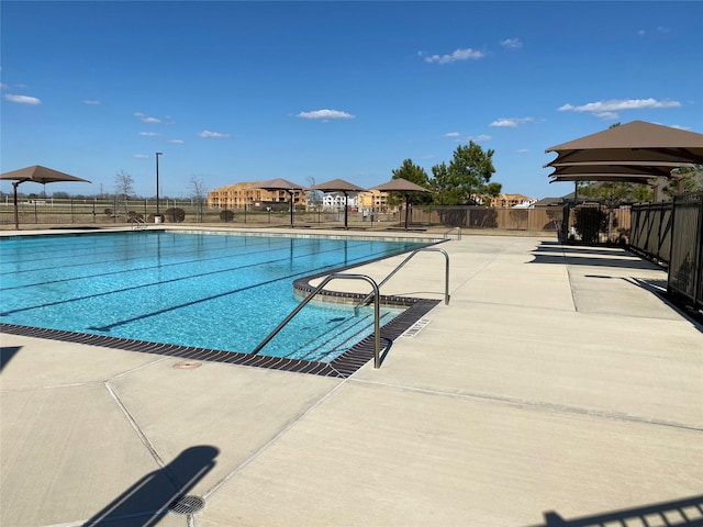 view of swimming pool with a gazebo and a patio area