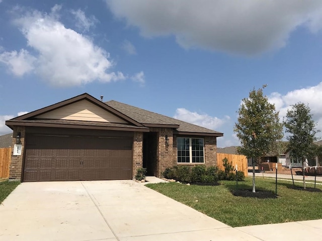 ranch-style home with a front yard and a garage