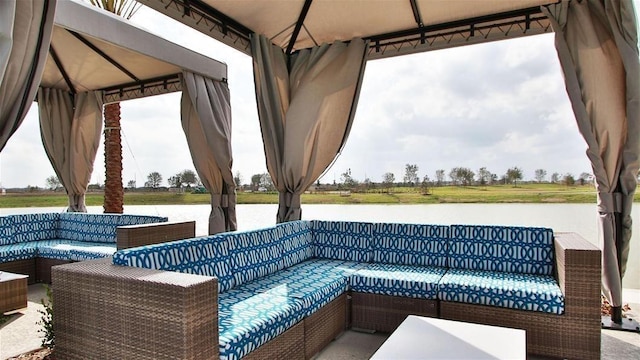 view of patio featuring an outdoor hangout area and a water view