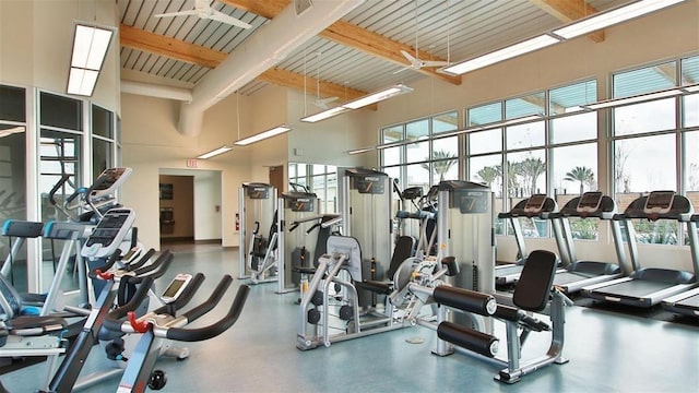 workout area with a high ceiling and wooden ceiling