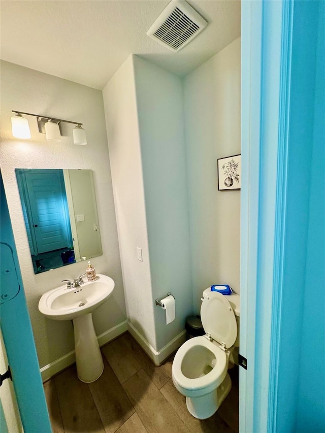 bathroom featuring toilet