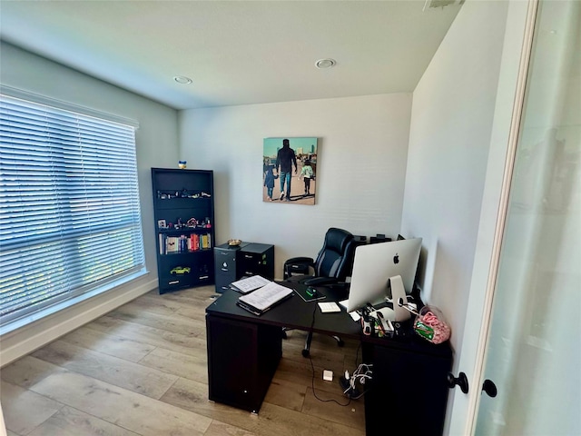 office with light hardwood / wood-style floors