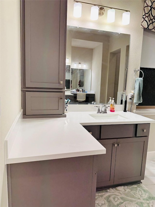 bathroom with vanity and tile patterned floors