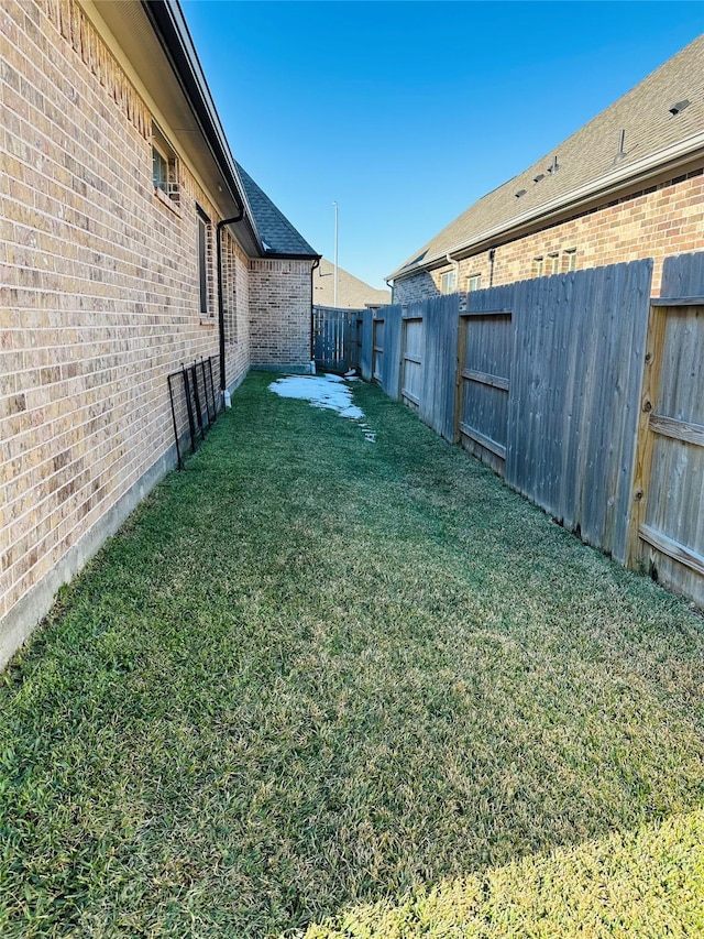 view of yard featuring a fenced backyard