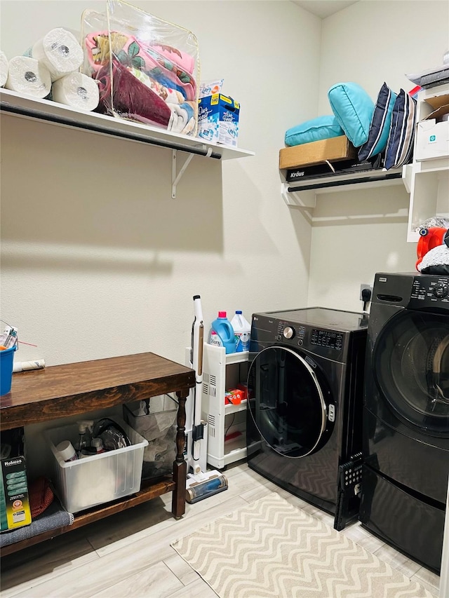 washroom featuring light hardwood / wood-style floors and independent washer and dryer