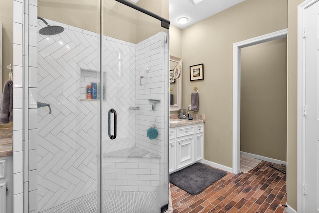 bathroom featuring vanity and an enclosed shower