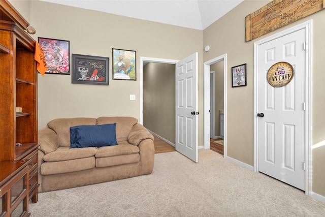 sitting room featuring light colored carpet