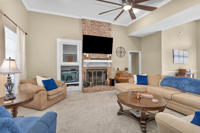 carpeted living room featuring crown molding, ceiling fan, and a brick fireplace