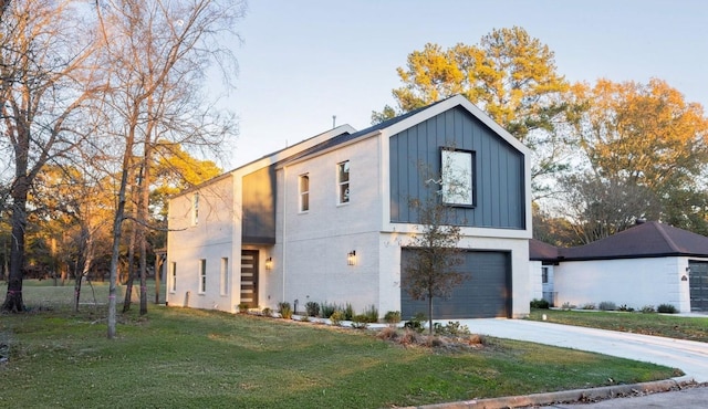 contemporary house with a garage and a front lawn