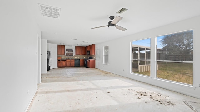 interior space featuring ceiling fan and a wealth of natural light