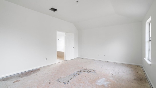 empty room with vaulted ceiling