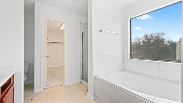 full bathroom featuring toilet, vanity, plenty of natural light, and independent shower and bath