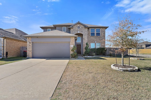 view of front of house with a garage and a front lawn