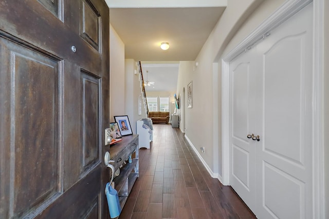 hall featuring dark wood-type flooring