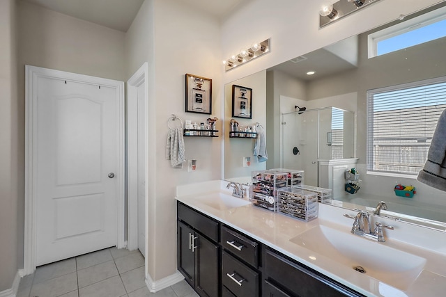 bathroom featuring tile patterned floors, plus walk in shower, and vanity