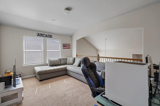 carpeted office space with vaulted ceiling