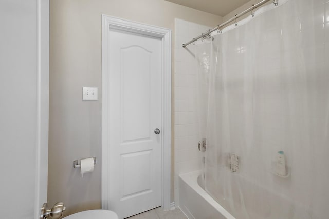 bathroom featuring shower / tub combo and tile patterned flooring