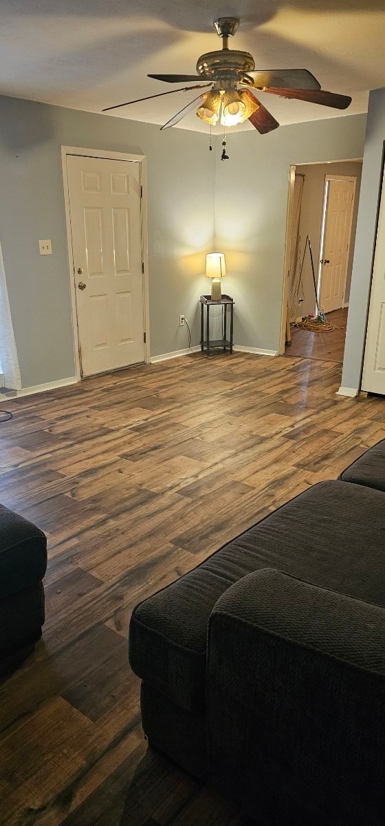 interior space with ceiling fan and hardwood / wood-style flooring