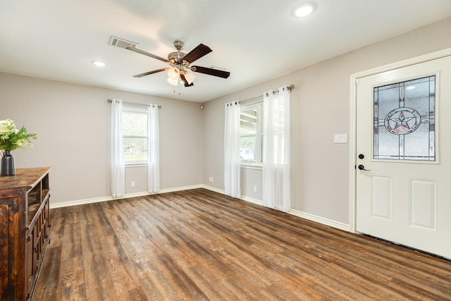 foyer entrance with ceiling fan and dark hardwood / wood-style floors