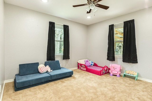 game room featuring ceiling fan and carpet flooring