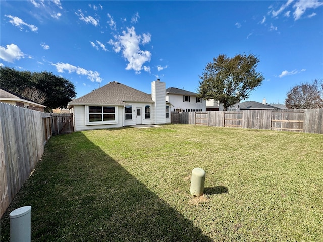 back of house featuring a yard