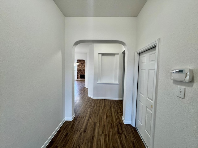 hall with dark hardwood / wood-style flooring