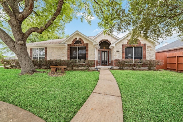 ranch-style house with a front yard