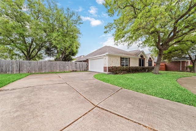 view of side of home featuring a garage and a lawn