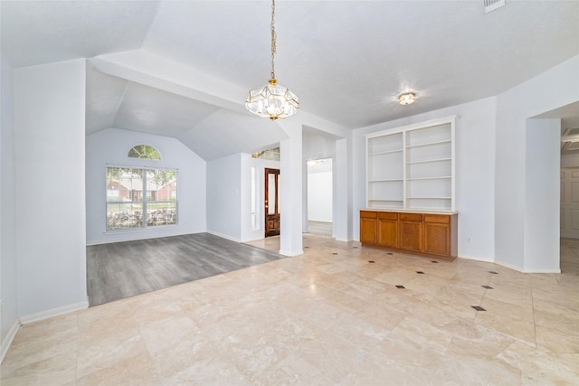 unfurnished living room featuring built in shelves, lofted ceiling, and an inviting chandelier