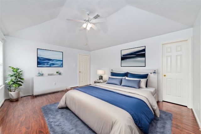 bedroom featuring vaulted ceiling, ceiling fan, and dark wood-type flooring