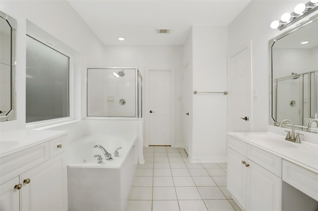 bathroom with vanity, tile patterned floors, and shower with separate bathtub